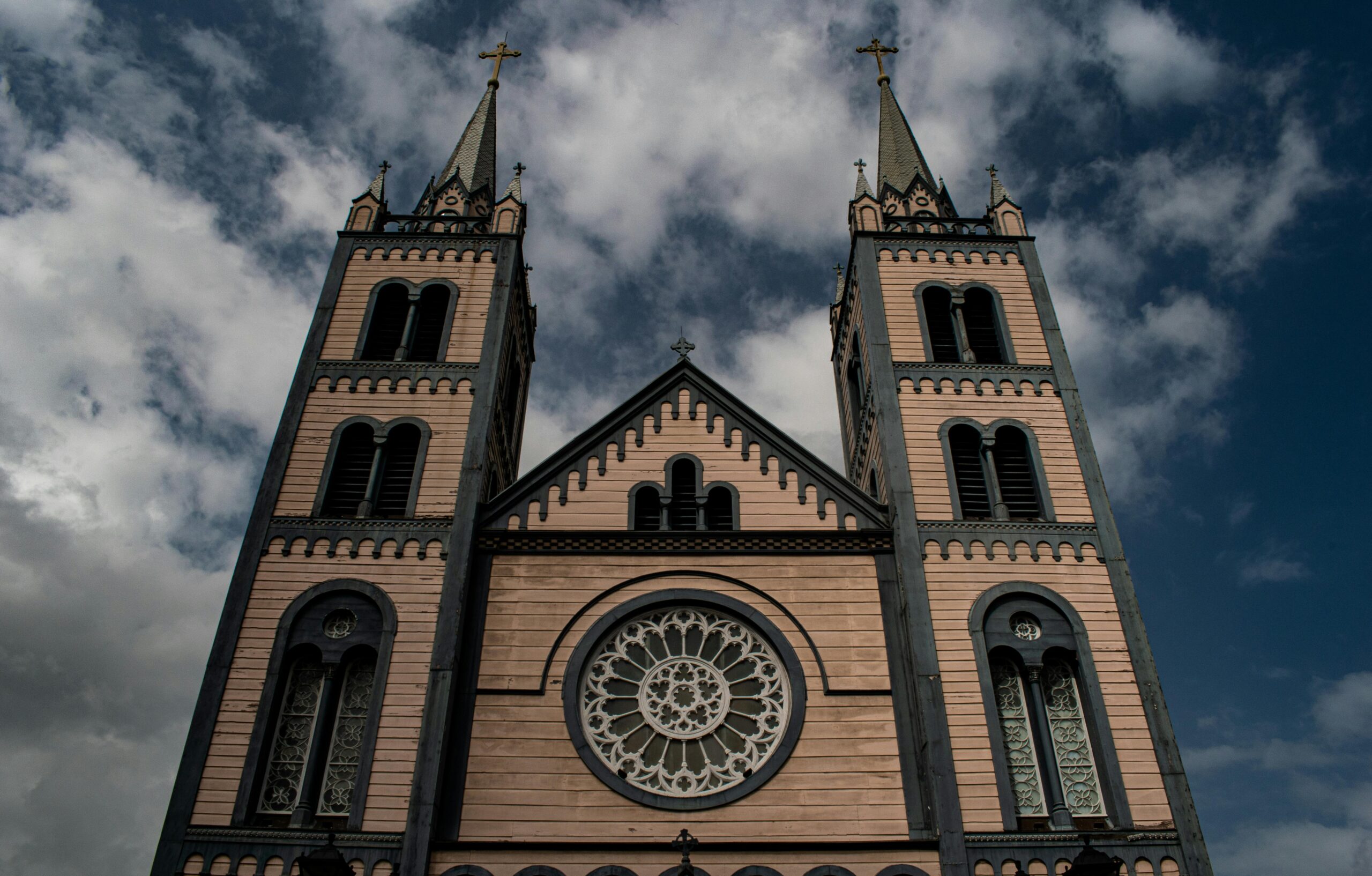Exterior view of St. Peter and Paul Cathedral showcasing its gothic architecture and twin towers in Suriname.